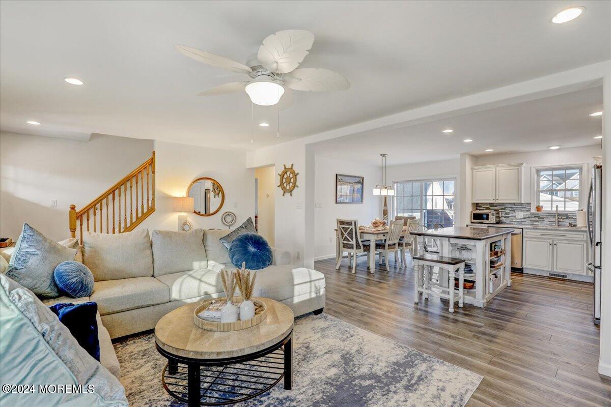 45 Vanard Drive Brick, NJ 08723 - Photo 10 of 52 a living room with furniture and a dining table with wooden floor