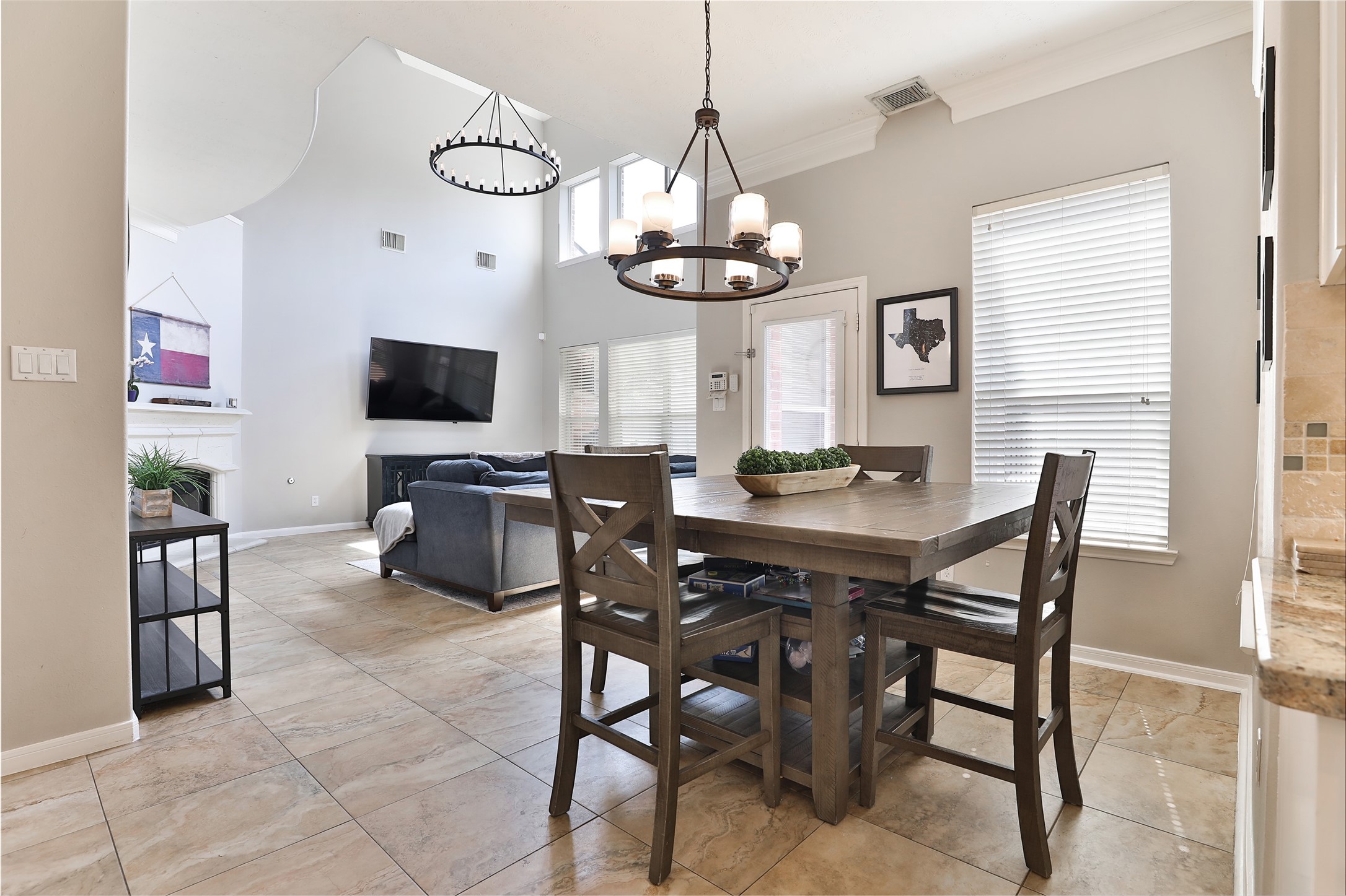 10514 Spice Ridge Row Missouri City, TX 77459 - Photo 12 of 43 a view of a dining room with furniture a chandelier and a window
