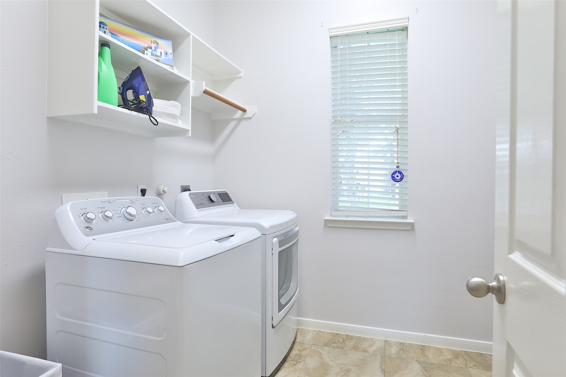 10514 Spice Ridge Row Missouri City, TX 77459 - Photo 20 of 43 a utility room with a sink dryer and washer