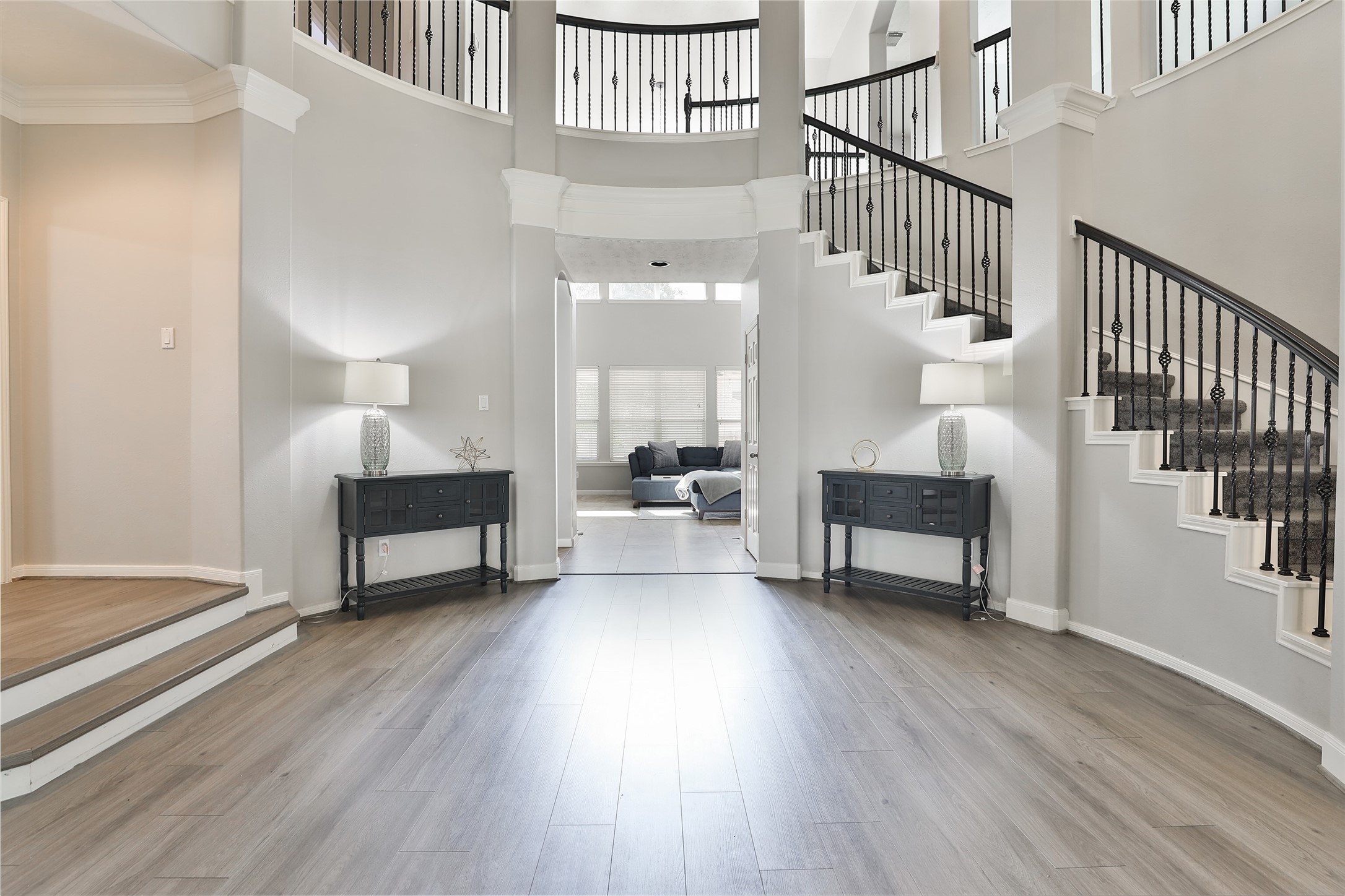 10514 Spice Ridge Row Missouri City, TX 77459 - Photo 3 of 43 a view of front door with dining room and wooden floor