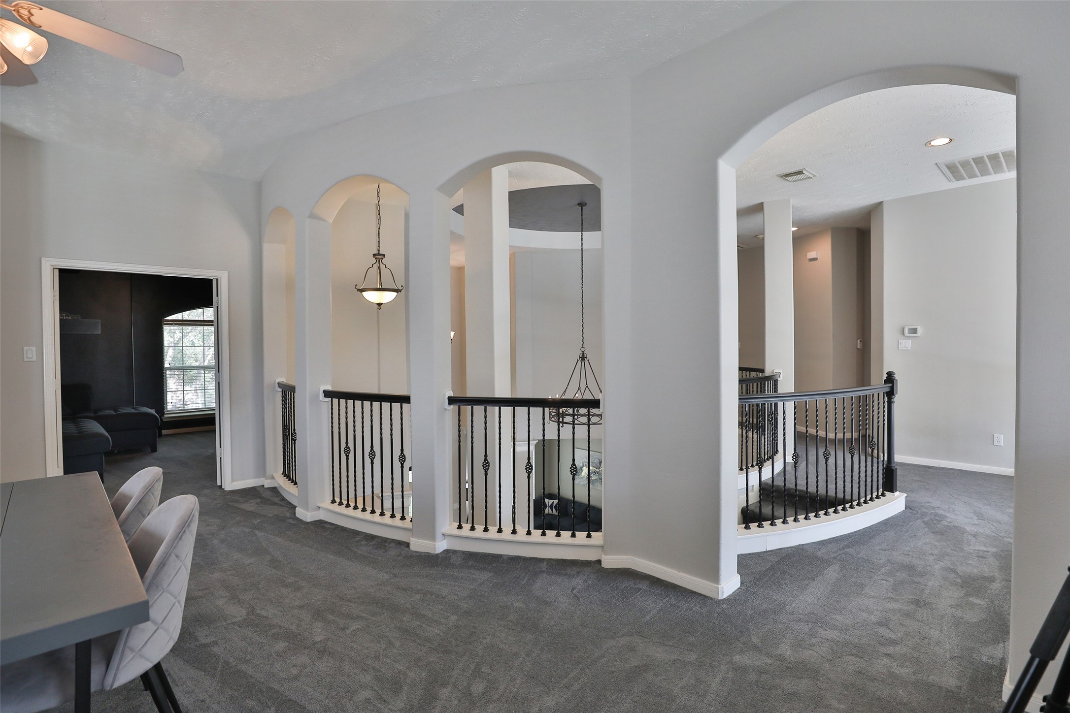 10514 Spice Ridge Row Missouri City, TX 77459 - Photo 34 of 43 a view of a hallway with wooden floor and windows