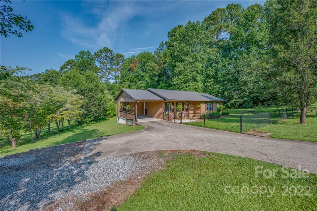 566 Edwards Street Rutherfordton, NC 28139 - Photo 3 of 28 a view of a house with a yard