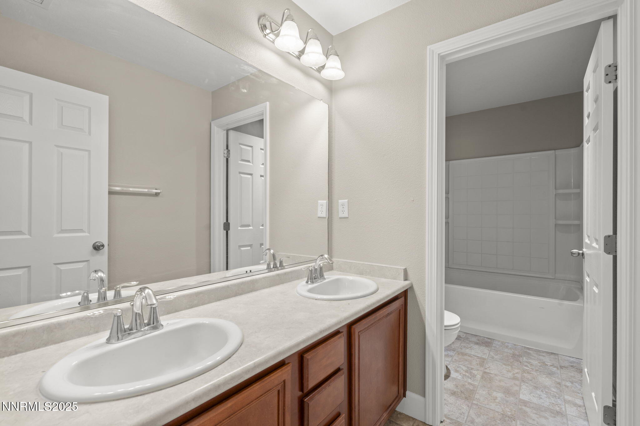 1955 Echo Valley Parkway Reno, NV 89521 - Photo 19 of 26 a bathroom with a sink double vanity and a mirror