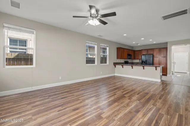 a view of kitchen with cabinets and window