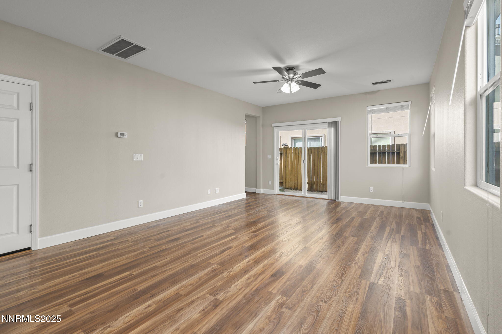 1955 Echo Valley Parkway Reno, NV 89521 - Photo 5 of 26 a view of empty room with wooden floor and fan