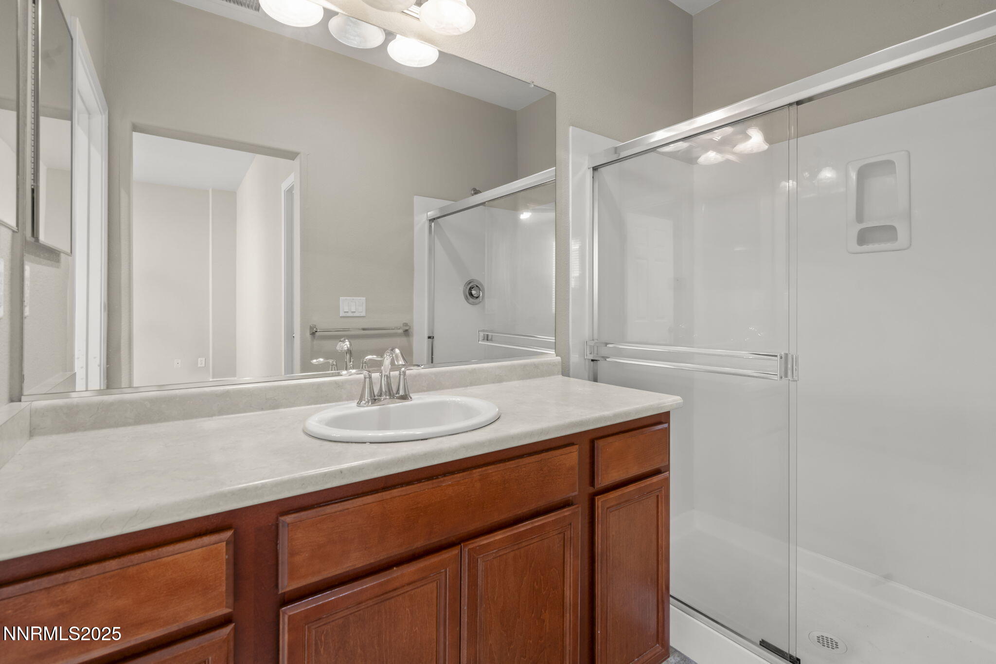 1955 Echo Valley Parkway Reno, NV 89521 - Photo 10 of 26 a bathroom with a sink and a mirror