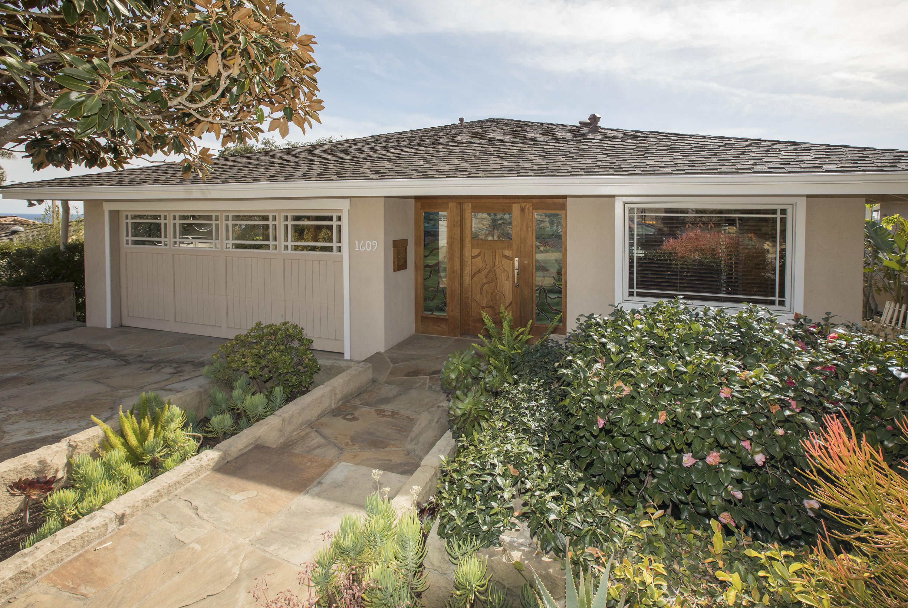 1609 Oramas Road Santa Barbara, CA 93103 - Photo 2 of 7 front view of a house with a yard