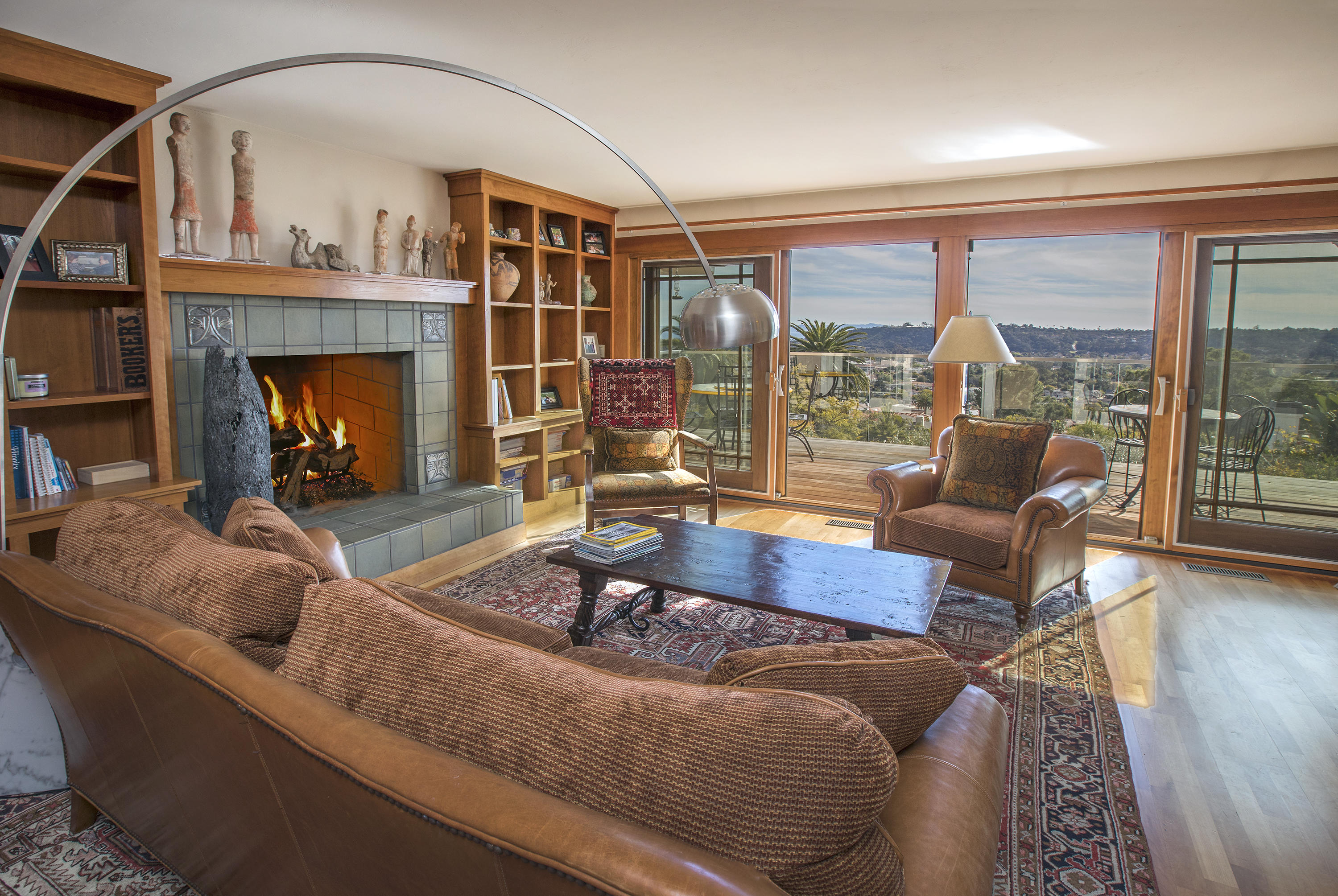 1609 Oramas Road Santa Barbara, CA 93103 - Photo 3 of 7 a living room with furniture and a fireplace