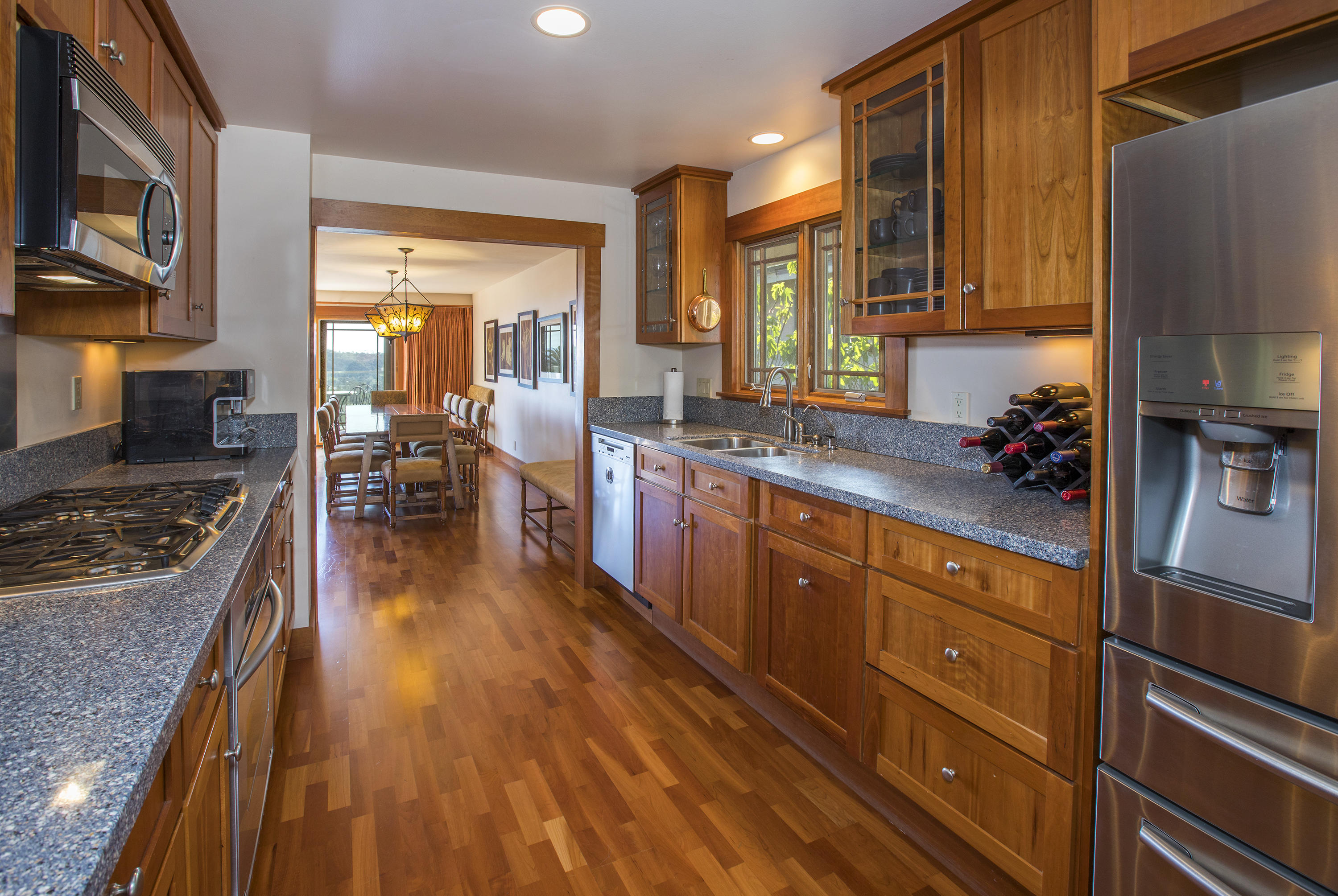 1609 Oramas Road Santa Barbara, CA 93103 - Photo 4 of 7 a kitchen with stainless steel appliances granite countertop a stove a sink dishwasher and a refrigerator with the countertops