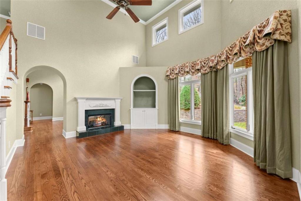 777 Oak Pointe Drive Cleveland, GA 30528 - Photo 11 of 63 a view of a hallway with wooden floor a fireplace and entryway