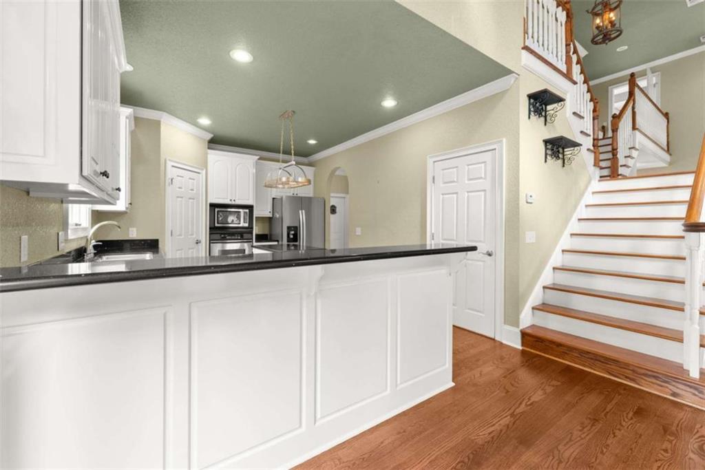 777 Oak Pointe Drive Cleveland, GA 30528 - Photo 19 of 63 a view of a kitchen with wooden floor and electronic appliances