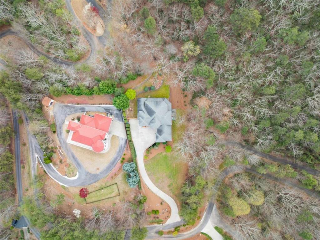 777 Oak Pointe Drive Cleveland, GA 30528 - Photo 3 of 63 an aerial view of a house with swimming pool and large trees