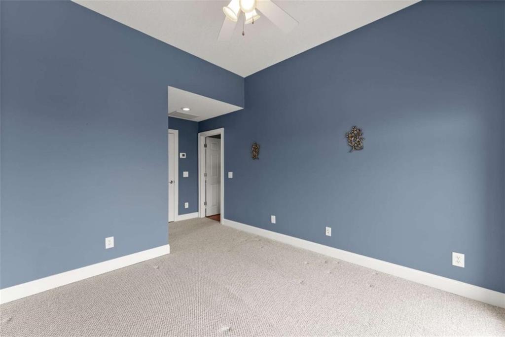 777 Oak Pointe Drive Cleveland, GA 30528 - Photo 43 of 63 a view of an empty room with a chandelier fan