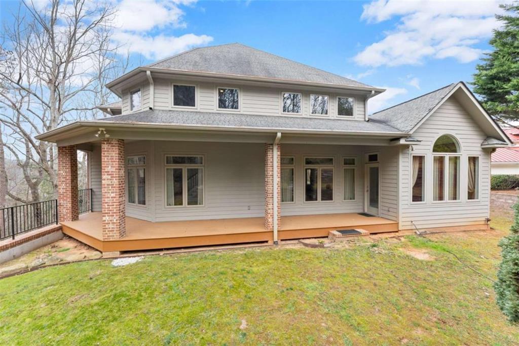 777 Oak Pointe Drive Cleveland, GA 30528 - Photo 49 of 63 a view of a house with a yard