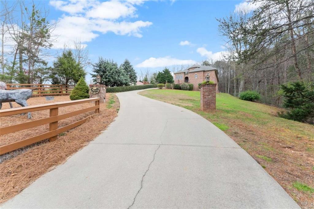 777 Oak Pointe Drive Cleveland, GA 30528 - Photo 53 of 63 a view of a street with houses on both side of the road