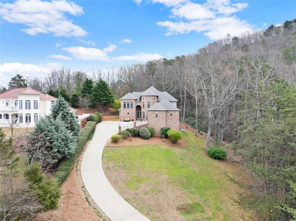 777 Oak Pointe Drive Cleveland, GA 30528 - Photo 55 of 63 a view of a house with a small yard