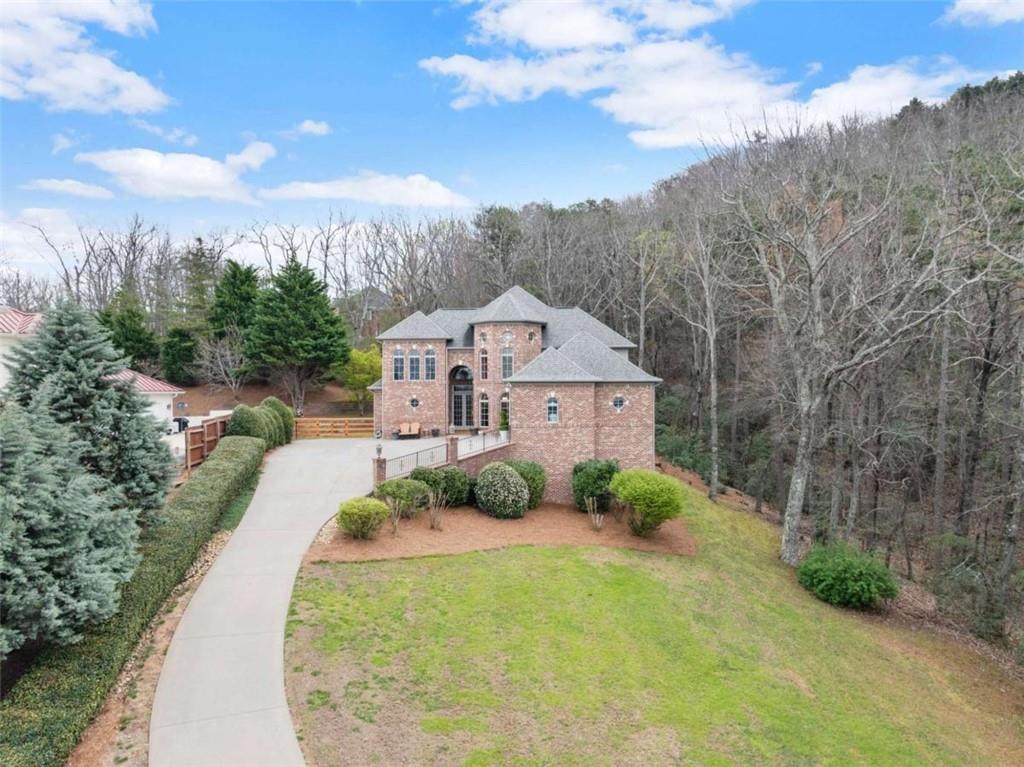 777 Oak Pointe Drive Cleveland, GA 30528 - Photo 7 of 63 a view of a house with a yard
