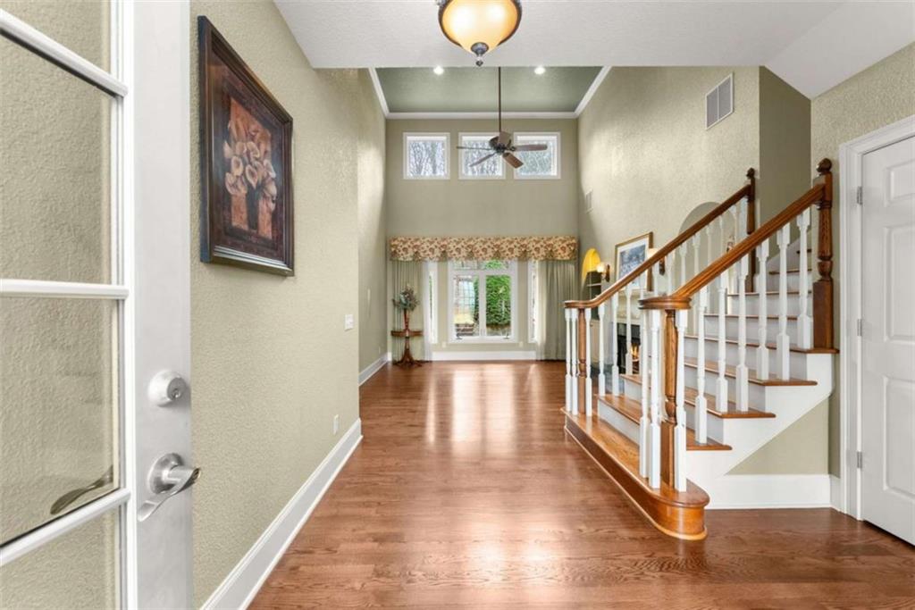 777 Oak Pointe Drive Cleveland, GA 30528 - Photo 8 of 63 a view of a hallway with wooden floor and staircase