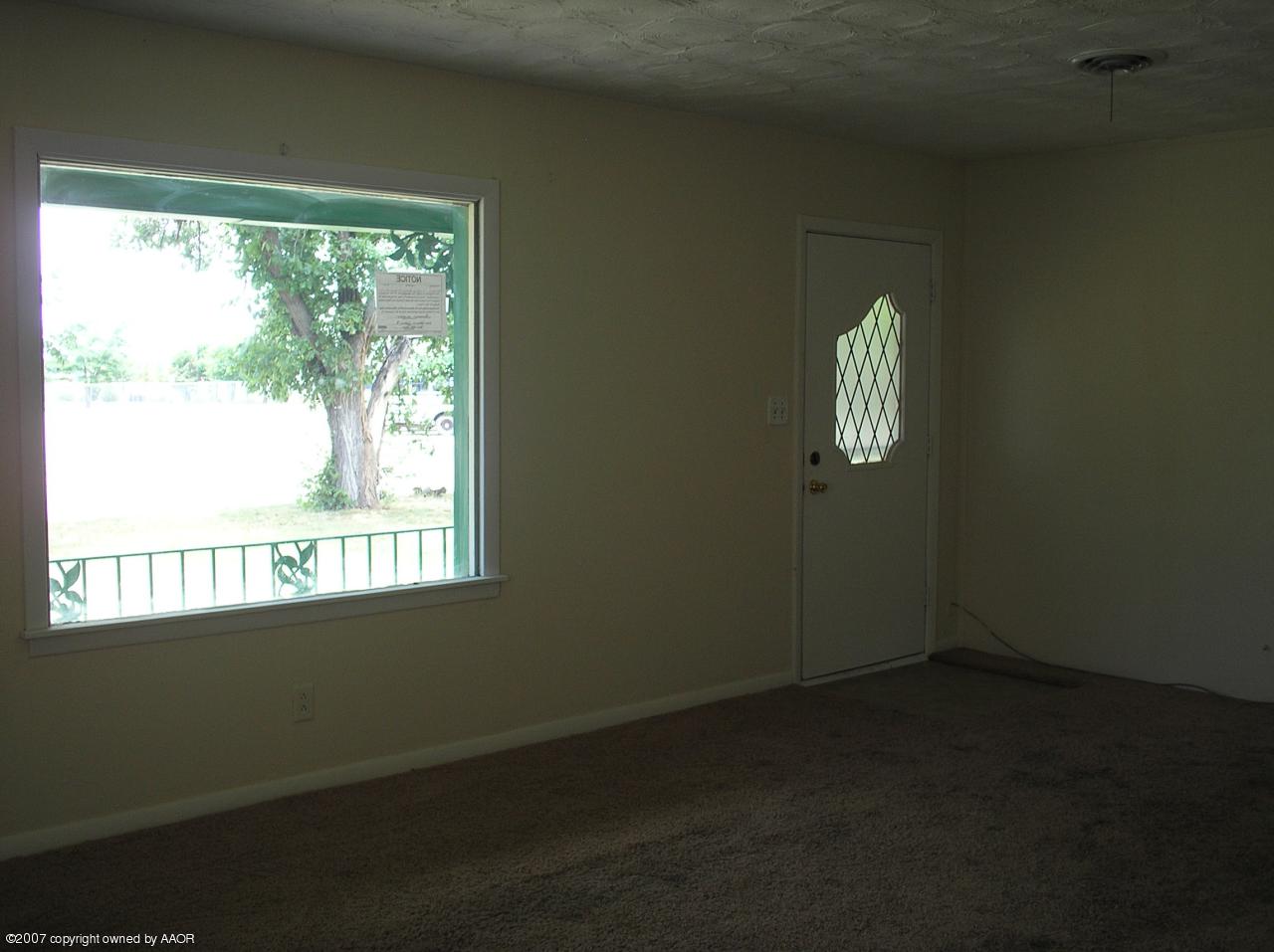 4105 South Bonham Street Amarillo, TX 79110 - Photo 3 of 5 a view of empty room with windows