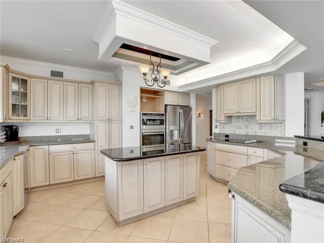 a kitchen with stainless steel appliances granite countertop a sink and cabinets