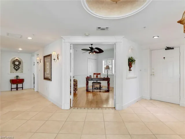 a view of a livingroom with furniture and a chandelier