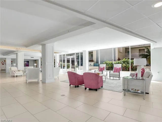 a living room with furniture and a table and chairs