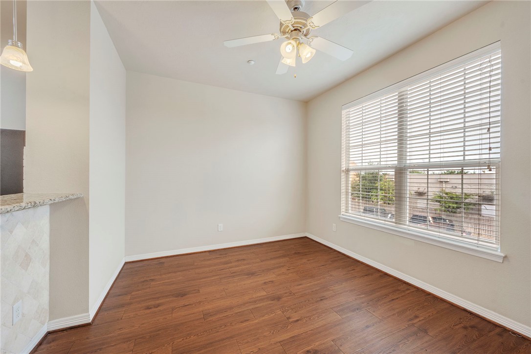 1198 Jones-Butler Road, Unit 2204 College Station, TX 77840 - Photo 3 of 9 a view of an empty room with wooden floor and a window