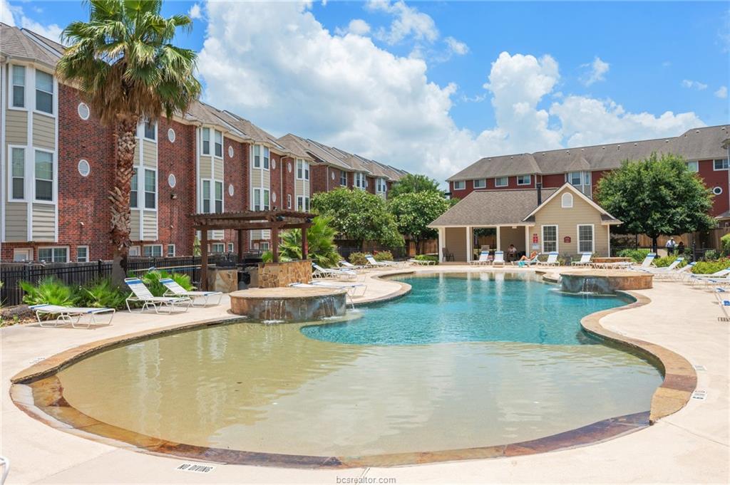 1198 Jones-Butler Road, Unit 2204 College Station, TX 77840 - Photo 8 of 9 a view of a house with swimming pool and sitting area