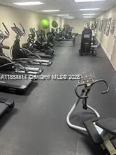 a kitchen with stove and cabinets