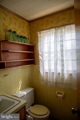 a view of closet area with wooden floor