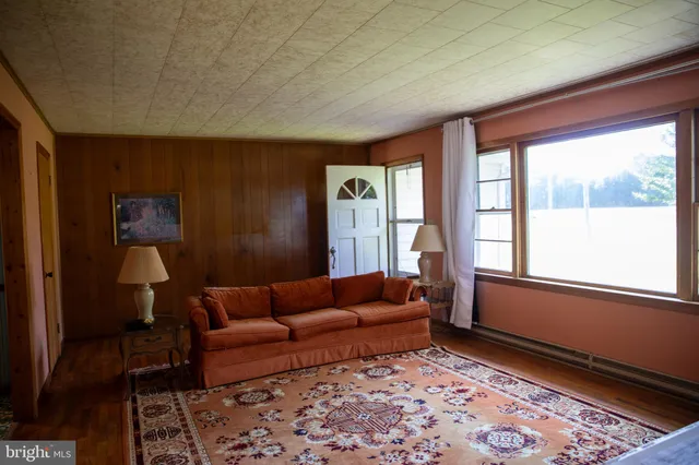 a view of a big house with a big yard