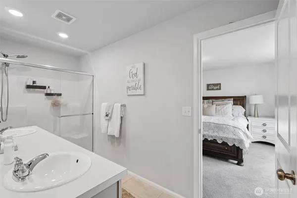a bathroom with a sink and a shower