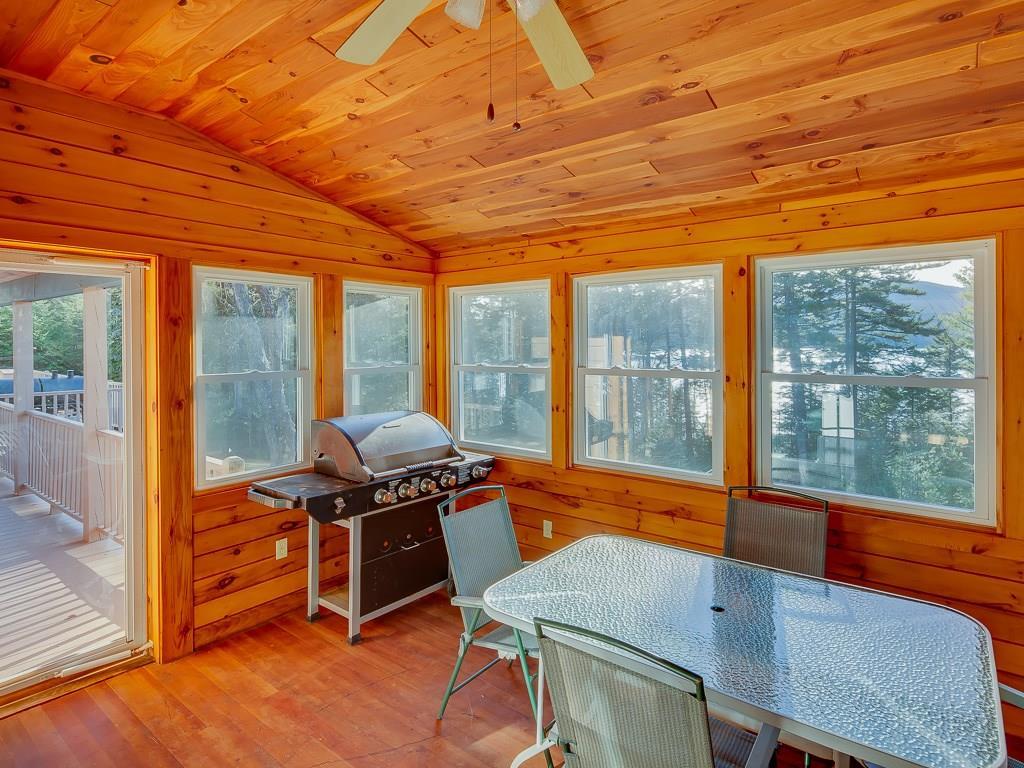 201 Pleasant Island Road Oquossoc, ME 04964 - Photo 14 of 31 screened porch is off the master and...