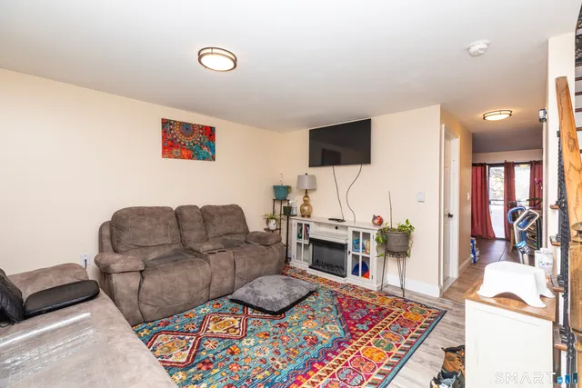 a living room with furniture and a rug