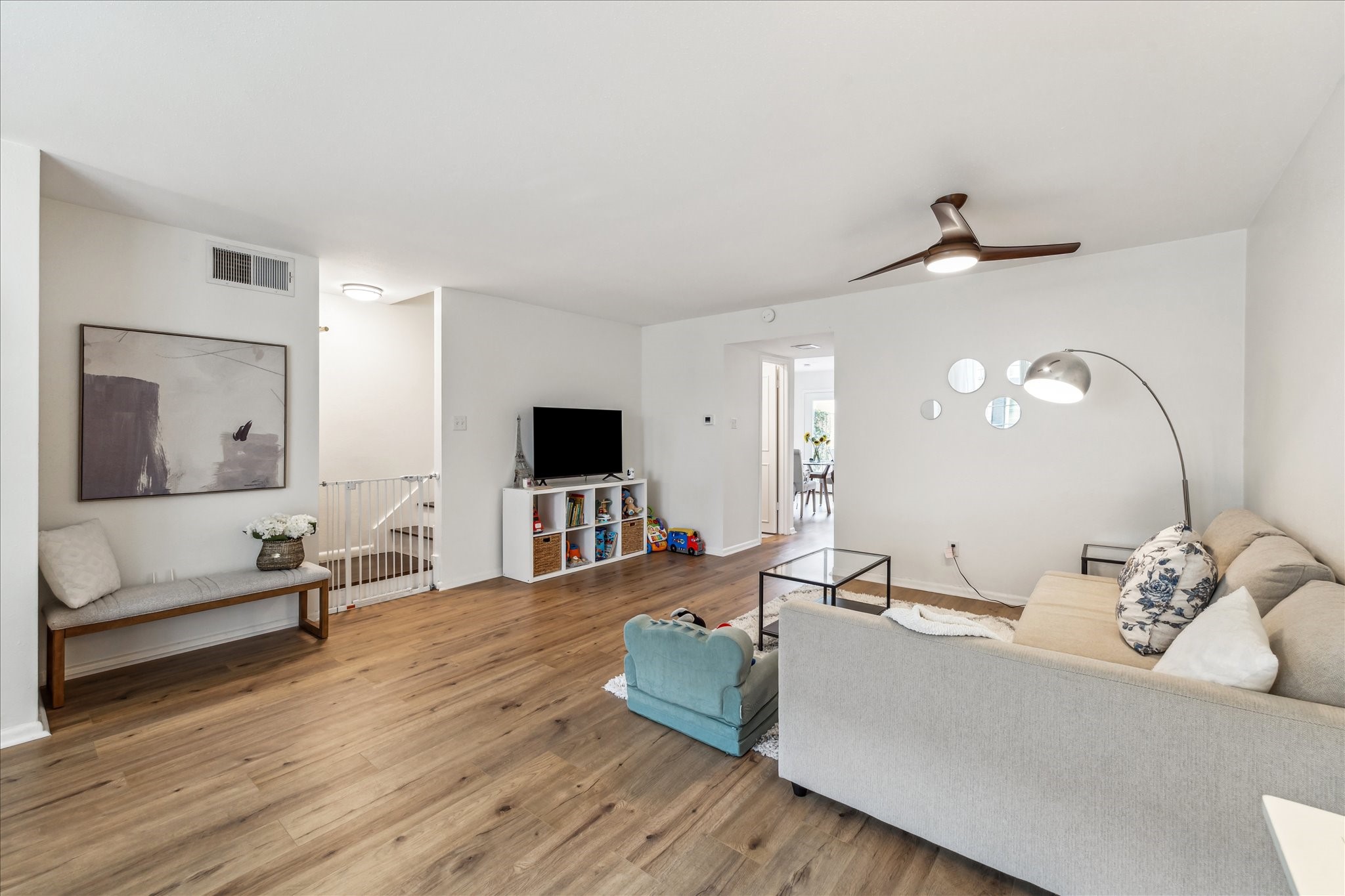 5823 Valley Forge Drive, Unit 93 Houston, TX 77057 - Photo 4 of 22 Spacious living room looking towards kitchen and dining area