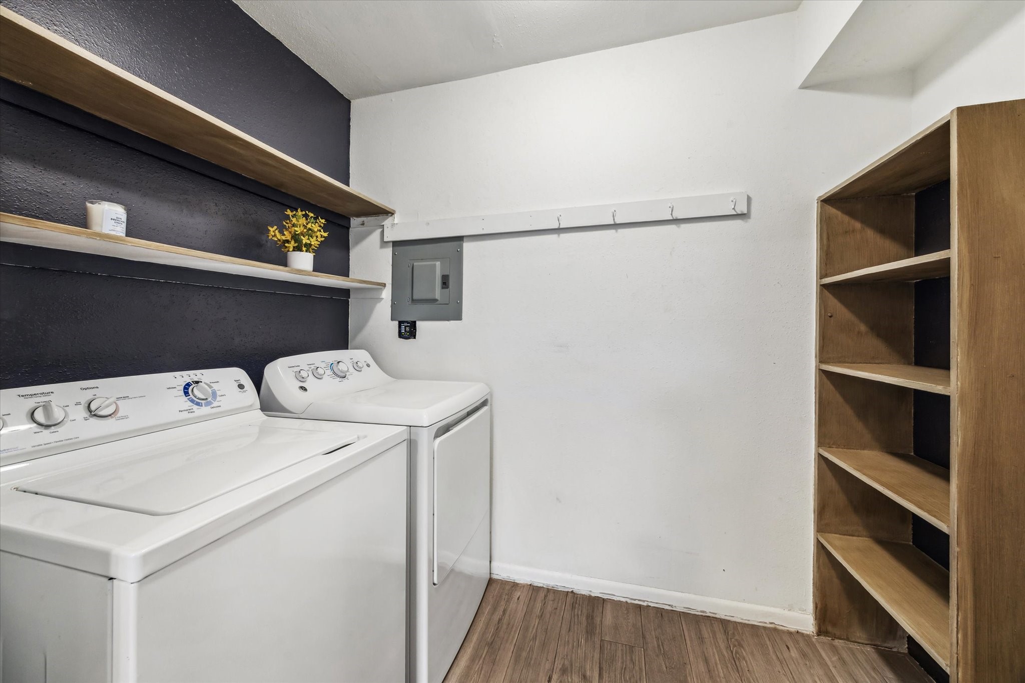 5823 Valley Forge Drive, Unit 93 Houston, TX 77057 - Photo 10 of 22 Utility room with shelf storage off of the kitchen