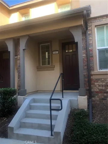 a kitchen with kitchen island stainless steel appliances a sink cabinets and a counter top space