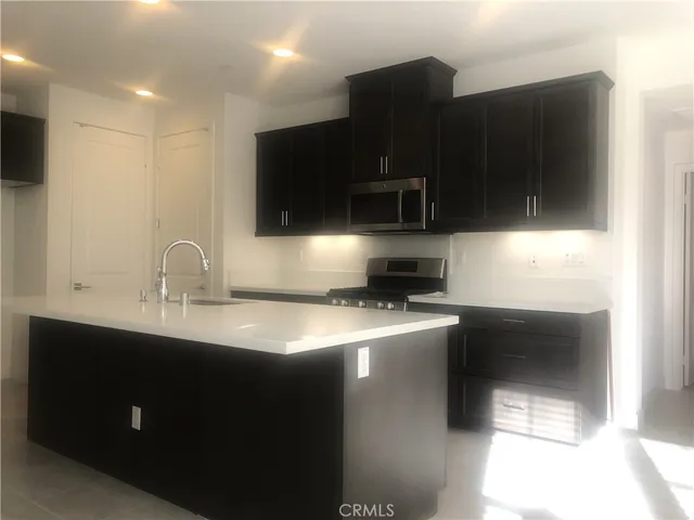 a bathroom with a shower and a sink