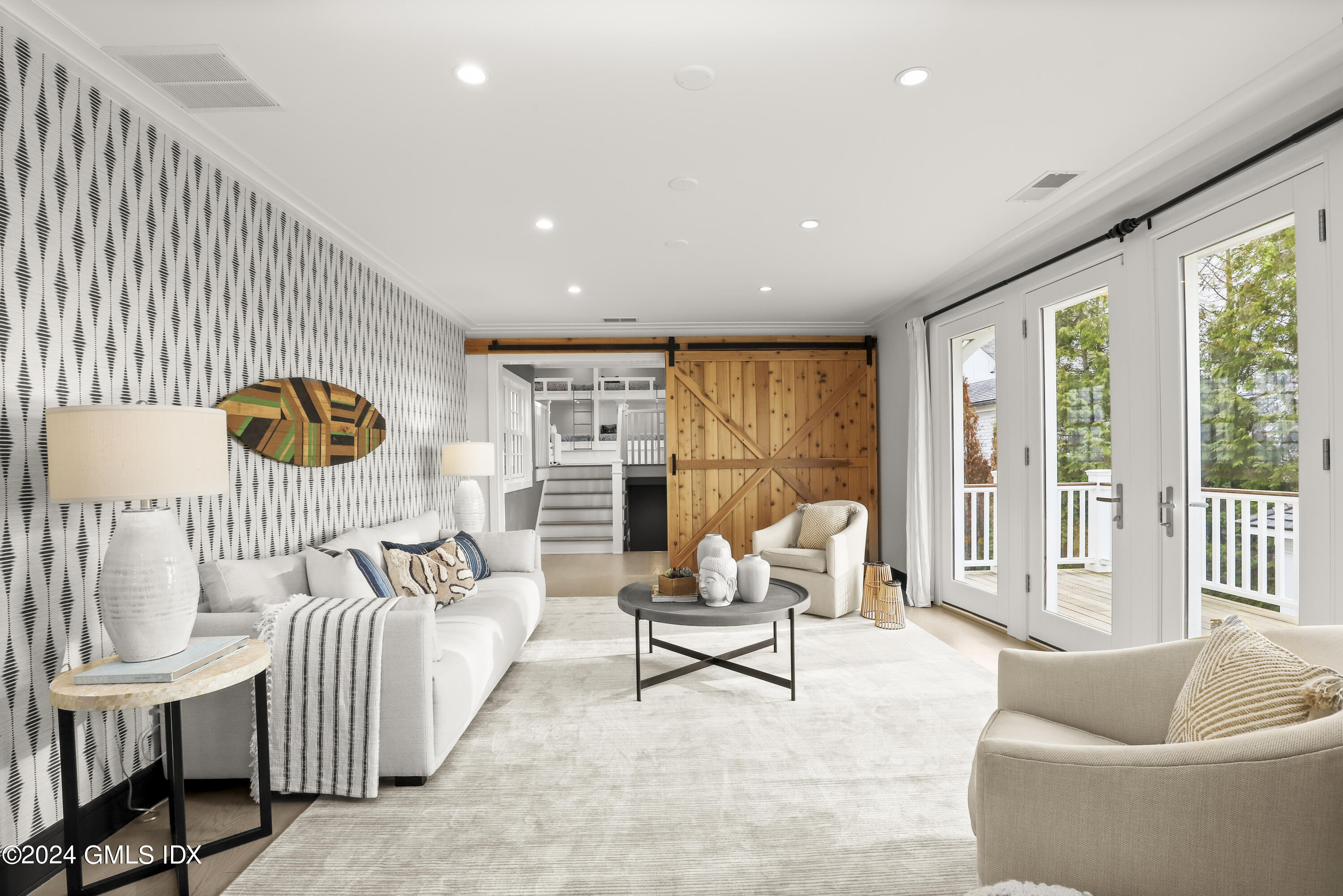195 Shore Road Old Greenwich, CT 06870 - Photo 12 of 39 a living room with furniture and a floor to ceiling window