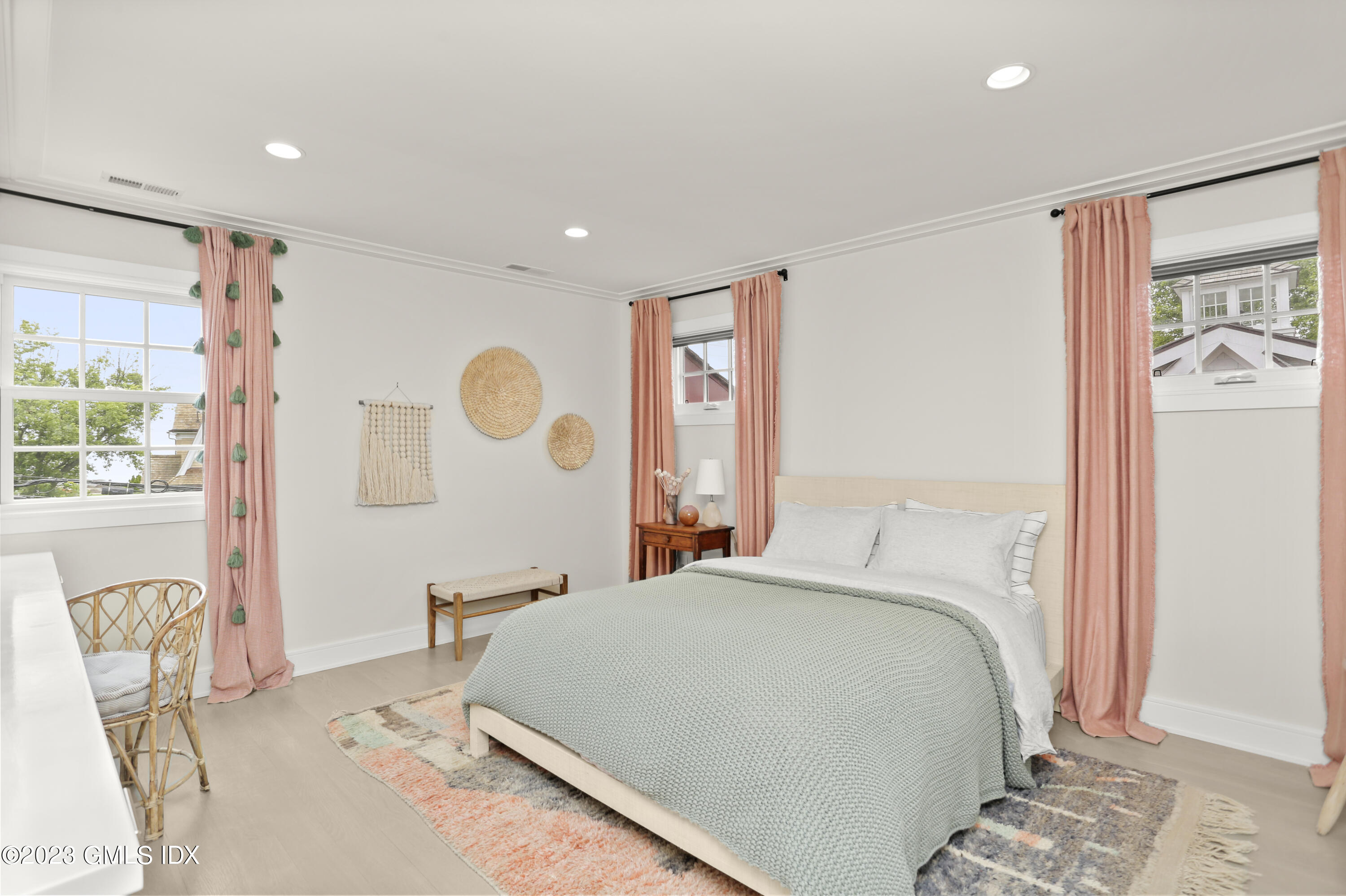 195 Shore Road Old Greenwich, CT 06870 - Photo 16 of 39 a bed room with a bed and a painting