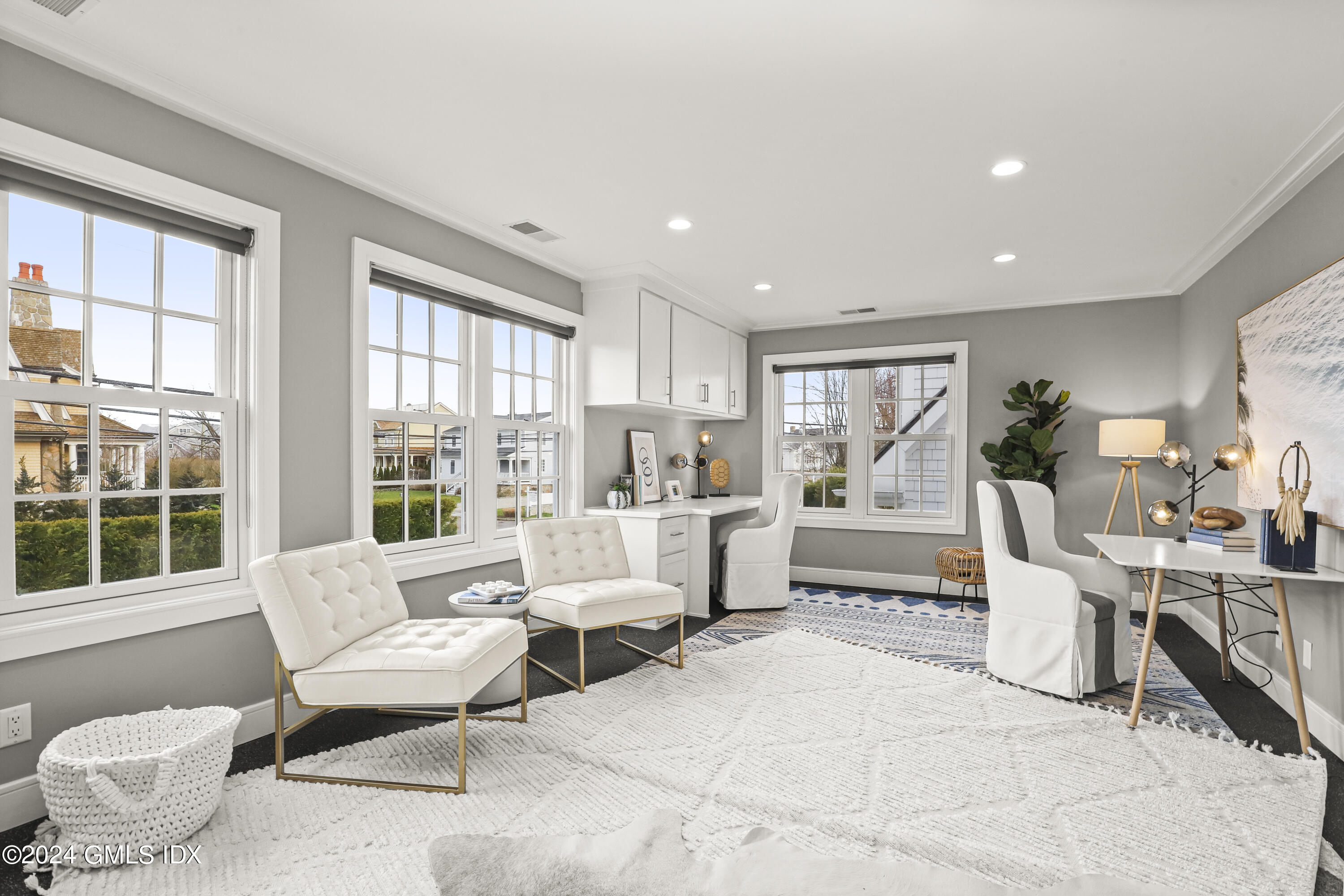 195 Shore Road Old Greenwich, CT 06870 - Photo 20 of 39 a living room with furniture and a large window