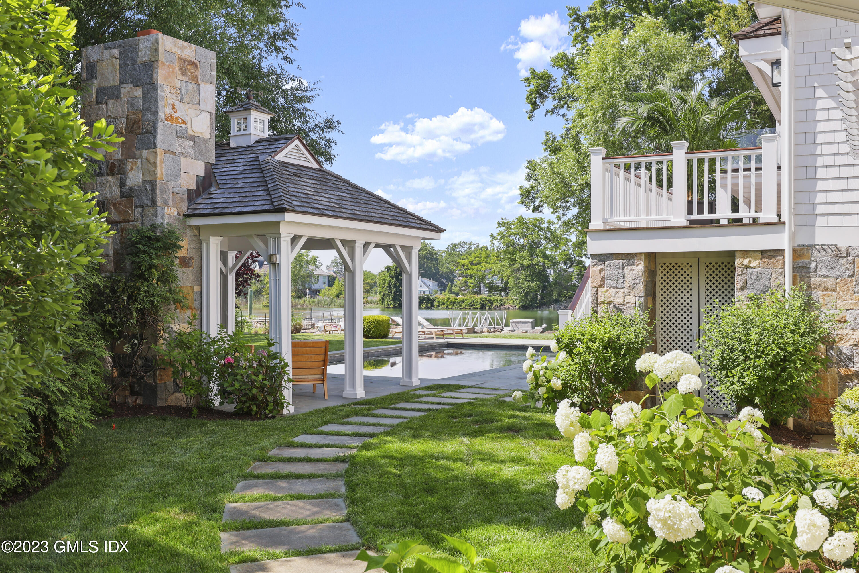 195 Shore Road Old Greenwich, CT 06870 - Photo 22 of 39 a house view with a garden space
