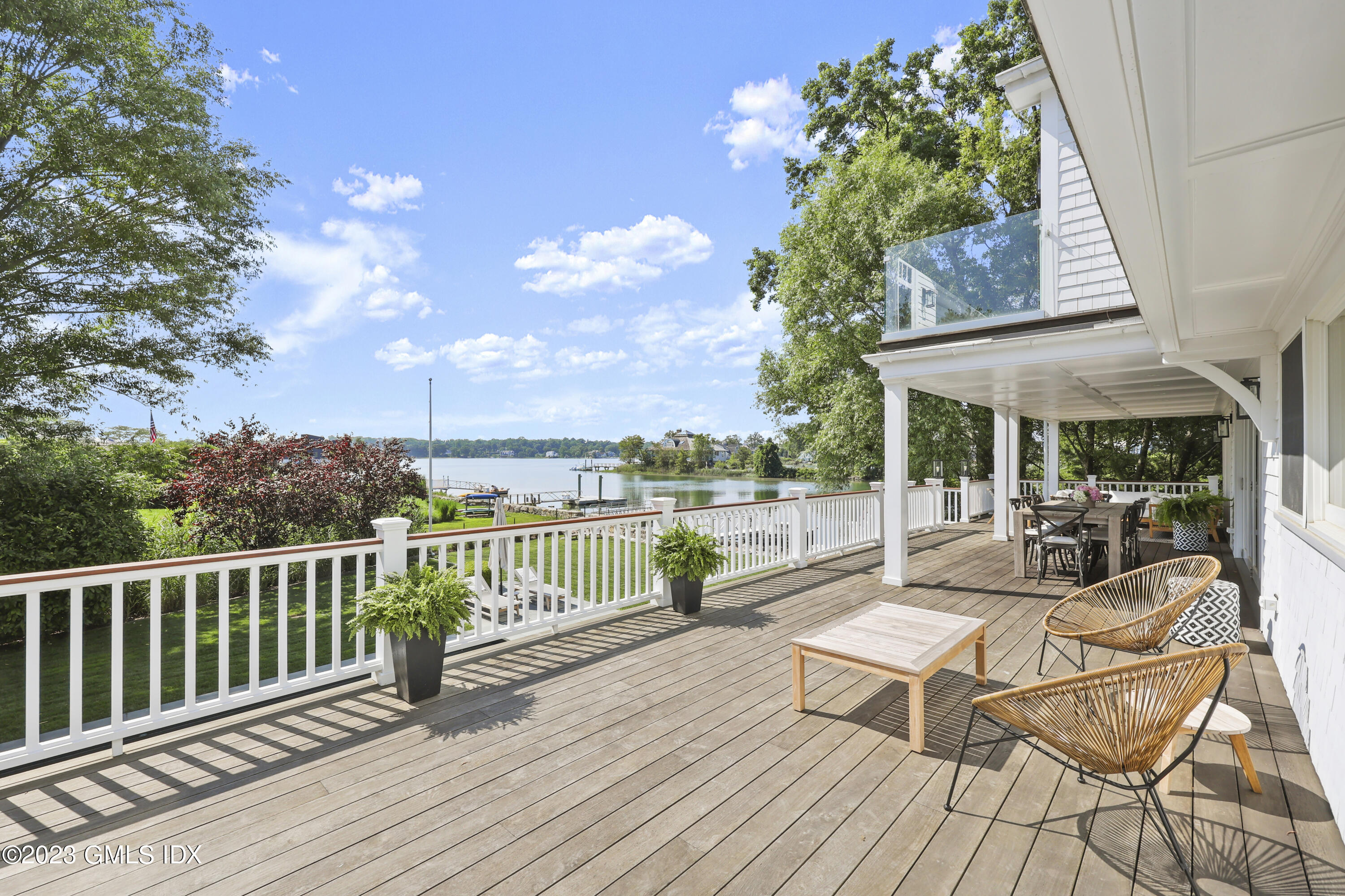 195 Shore Road Old Greenwich, CT 06870 - Photo 25 of 39 a view of a patio with couches table and chairs