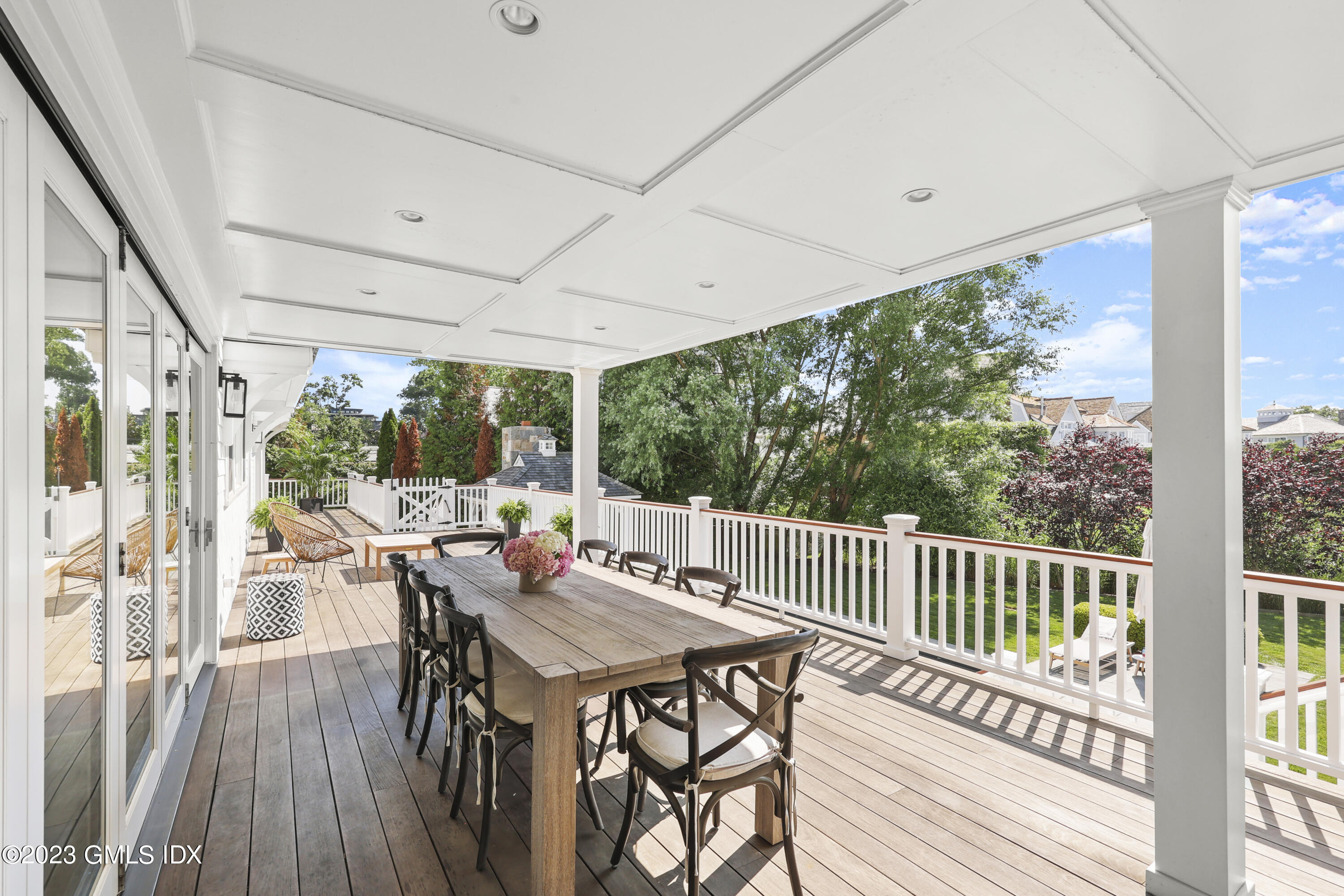 195 Shore Road Old Greenwich, CT 06870 - Photo 27 of 39 a view of a patio with a table chairs and a table