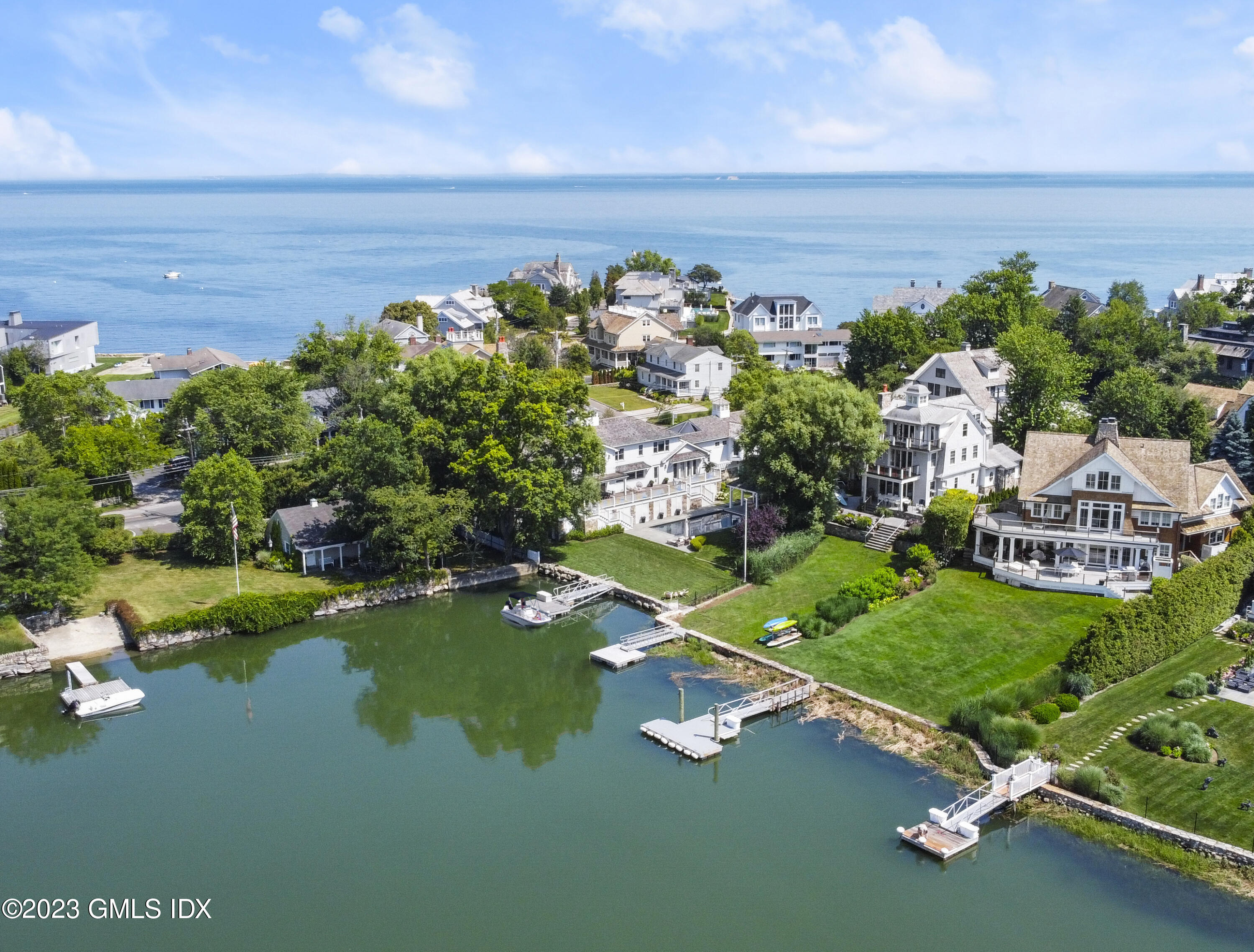 195 Shore Road Old Greenwich, CT 06870 - Photo 30 of 39 a view of a lake with a building in the back