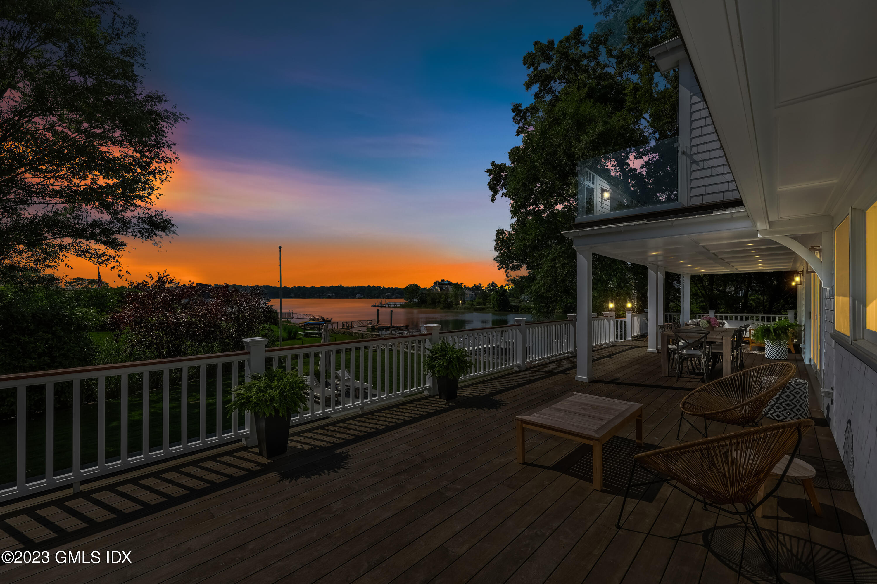 195 Shore Road Old Greenwich, CT 06870 - Photo 35 of 39 a view of a roof deck with wooden floor and fence