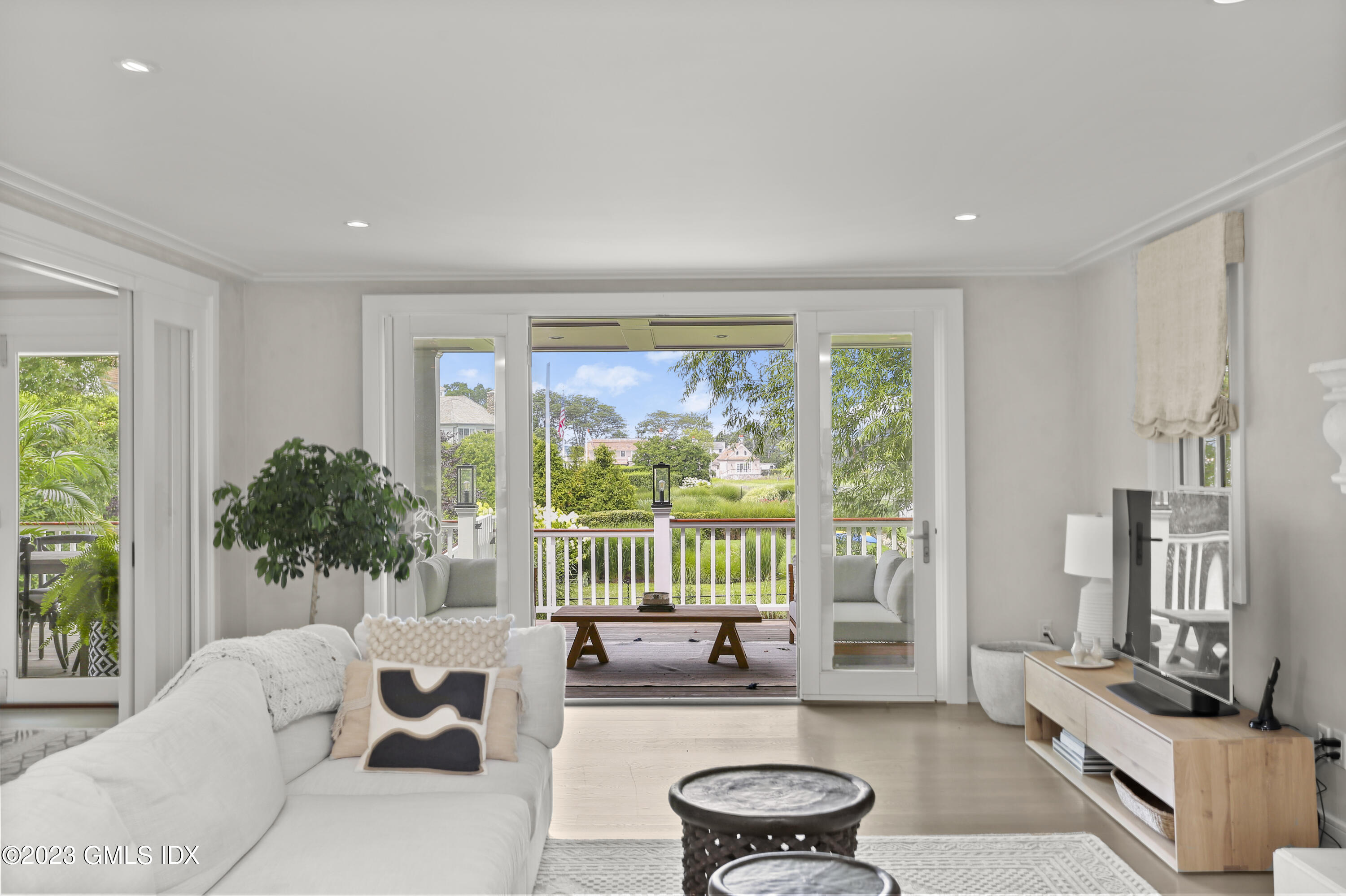 195 Shore Road Old Greenwich, CT 06870 - Photo 7 of 39 a living room with furniture and a potted plant