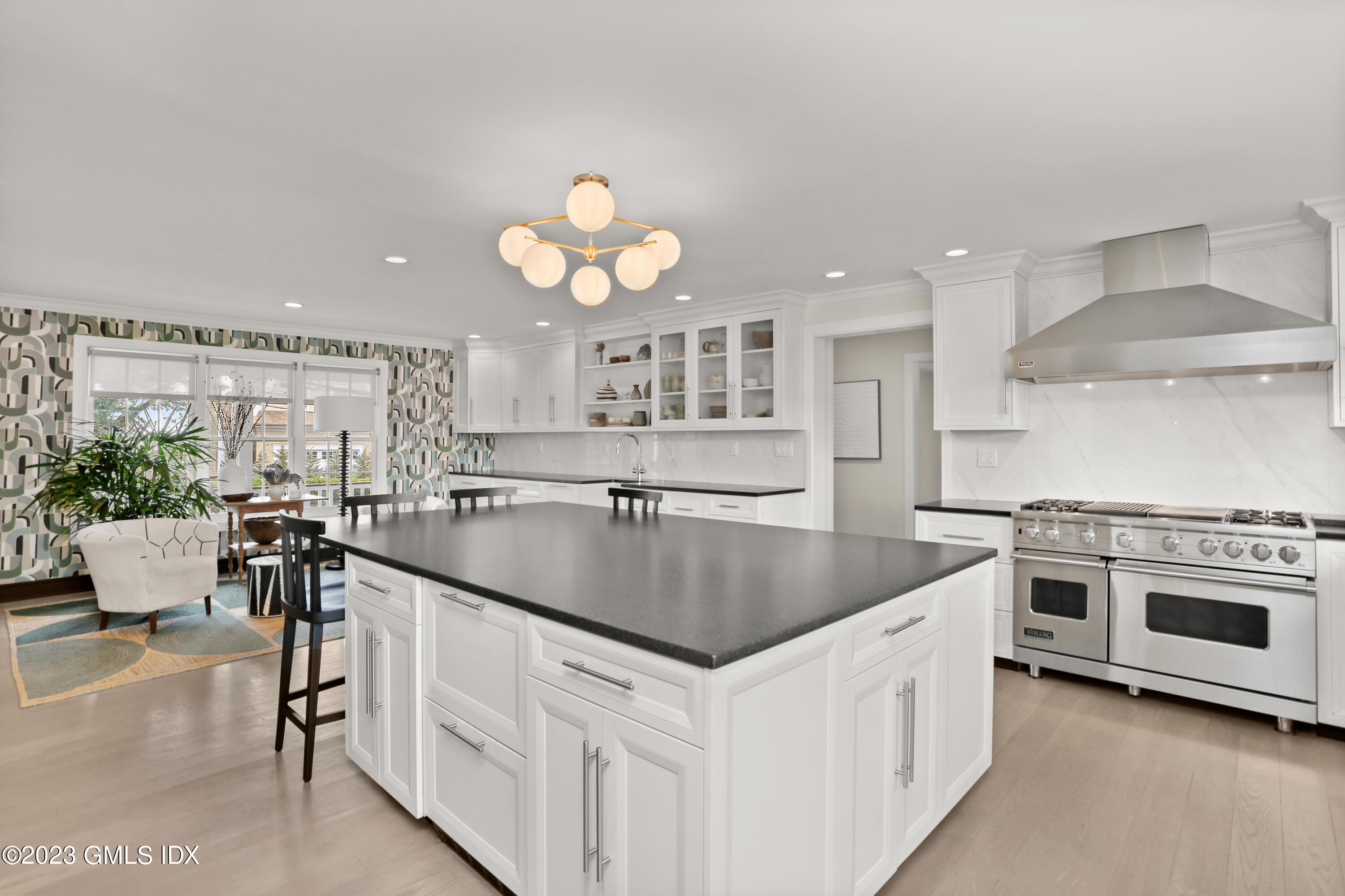 195 Shore Road Old Greenwich, CT 06870 - Photo 10 of 39 a kitchen with a stove cabinets and chairs