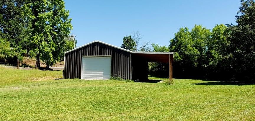 767 Lane Hollow Road Sevierville, TN 37876 - Photo 4 of 31 a view of a house with backyard and trees