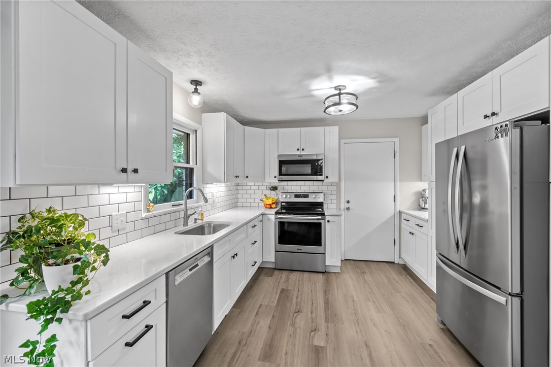 2591 Woodview Road Uniontown, OH 44685 - Photo 10 of 46 Beautifully remodeled kitchen with stainless steel appliances.